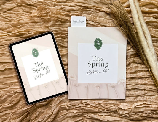 Tablet and paper with 'The Spring Edition 001' on a textured surface